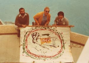 Anibal Guevara, Laurie Woods and Hugo Becerra with the Salvador Dali painting